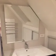 Mirror ice under roof with cut angle