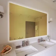 Rectangular mirror with golden tinted glass