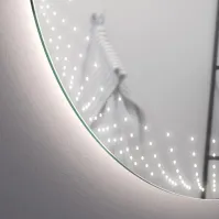 Round illuminated mirror with 3D effect - in a living room