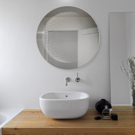 Round LED mirror with 3D effect for a modern touch.