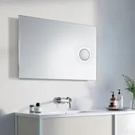 Illuminated mirror with makeup area for precise application.