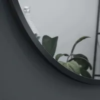 round cylindrical mirror with thin frame painted in colors