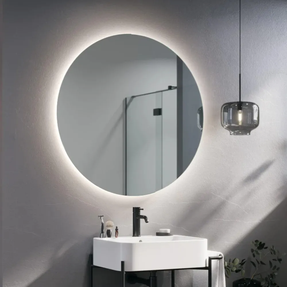 Round mirror with integrated backlighting for ambient lighting