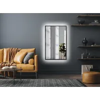 Modern backlit mirror with black frame ideal for interiors.
