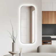 Slim mirror with rounded backlit frame