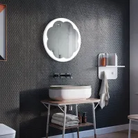 Round illuminated mirror with flower decoration