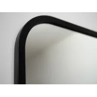 Distorted vertical mirror with black frame